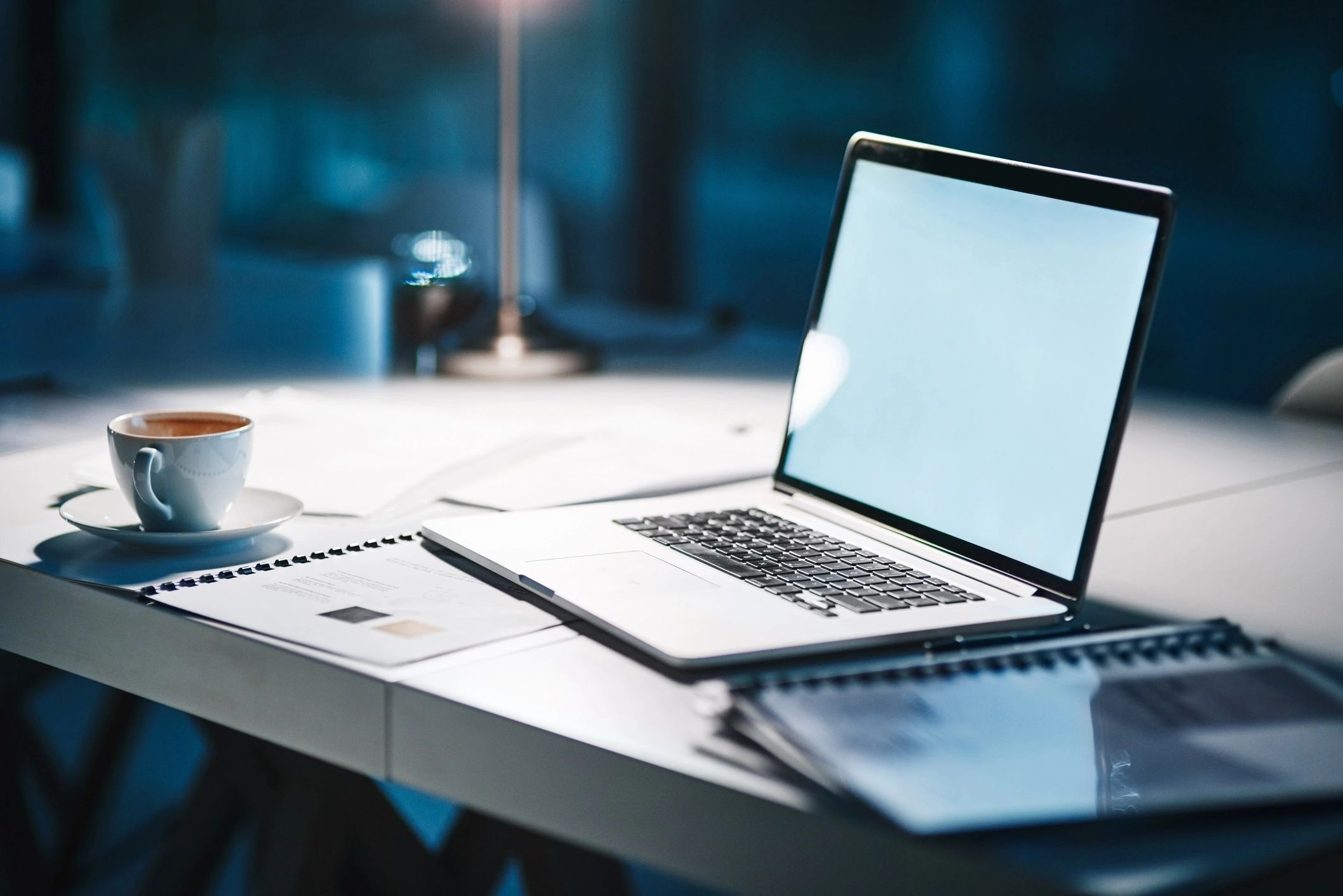 Modern office desk with laptop and workspace